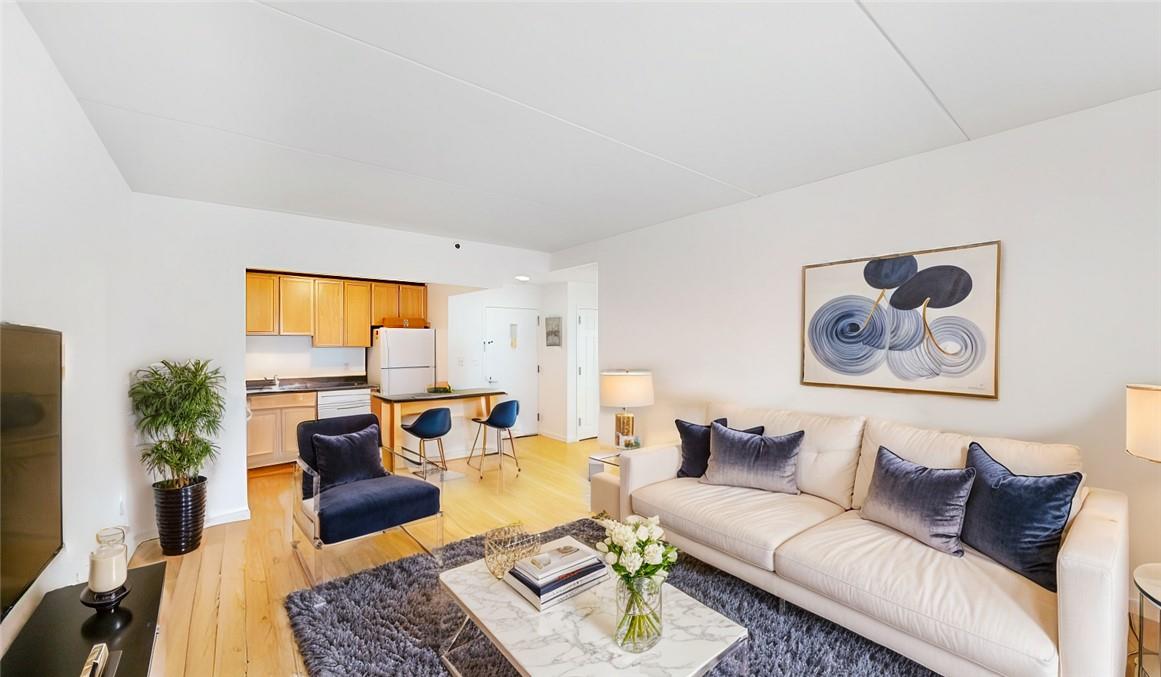 Living room featuring light hardwood / wood-style floors and sink