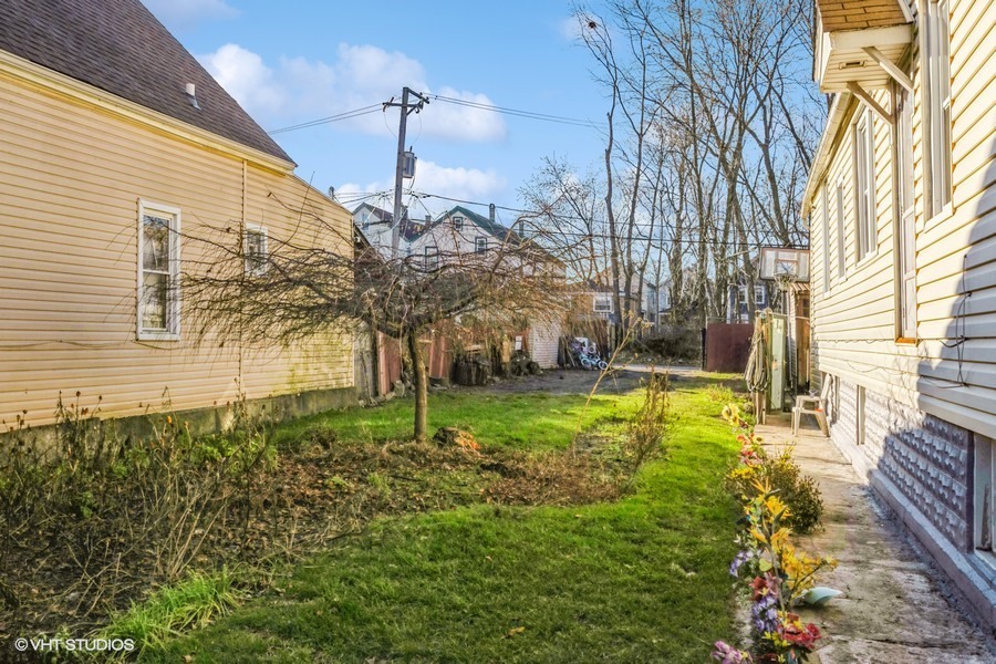 a view of a backyard of the house