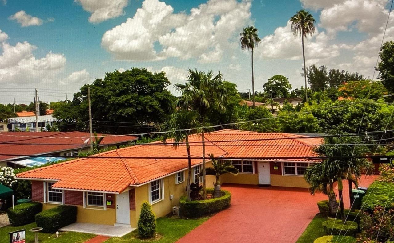 a view of house with outdoor space and swimming pool