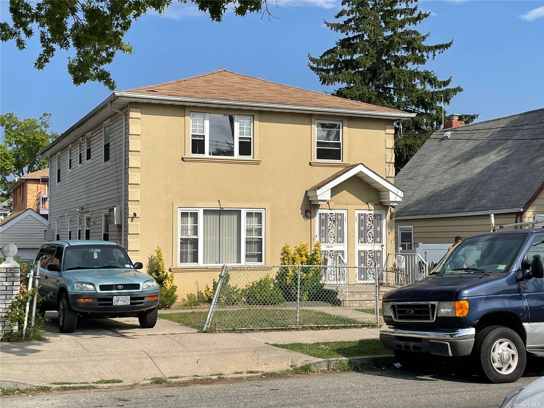 a view of a car parked in front of a house