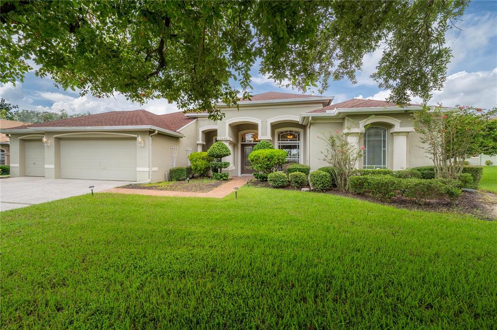 a front view of a house with garden