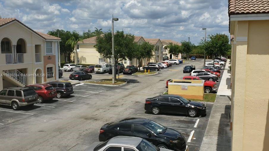 a view of a street with cars