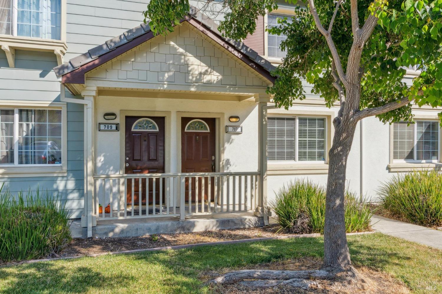 a front view of a house with garden