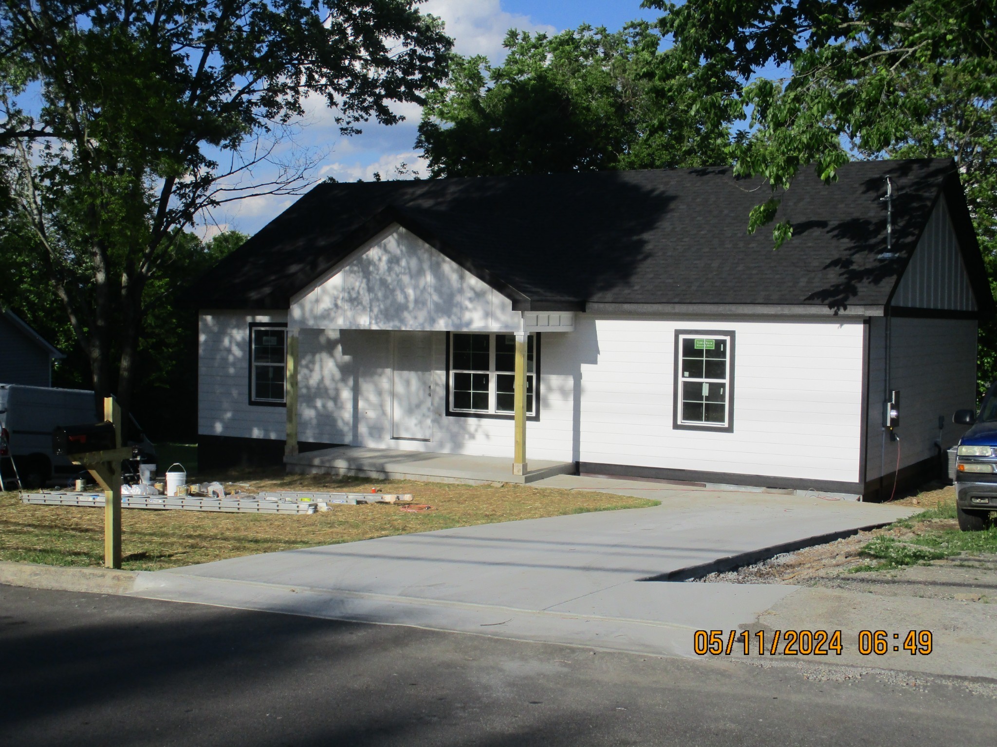 a front view of a house with garden