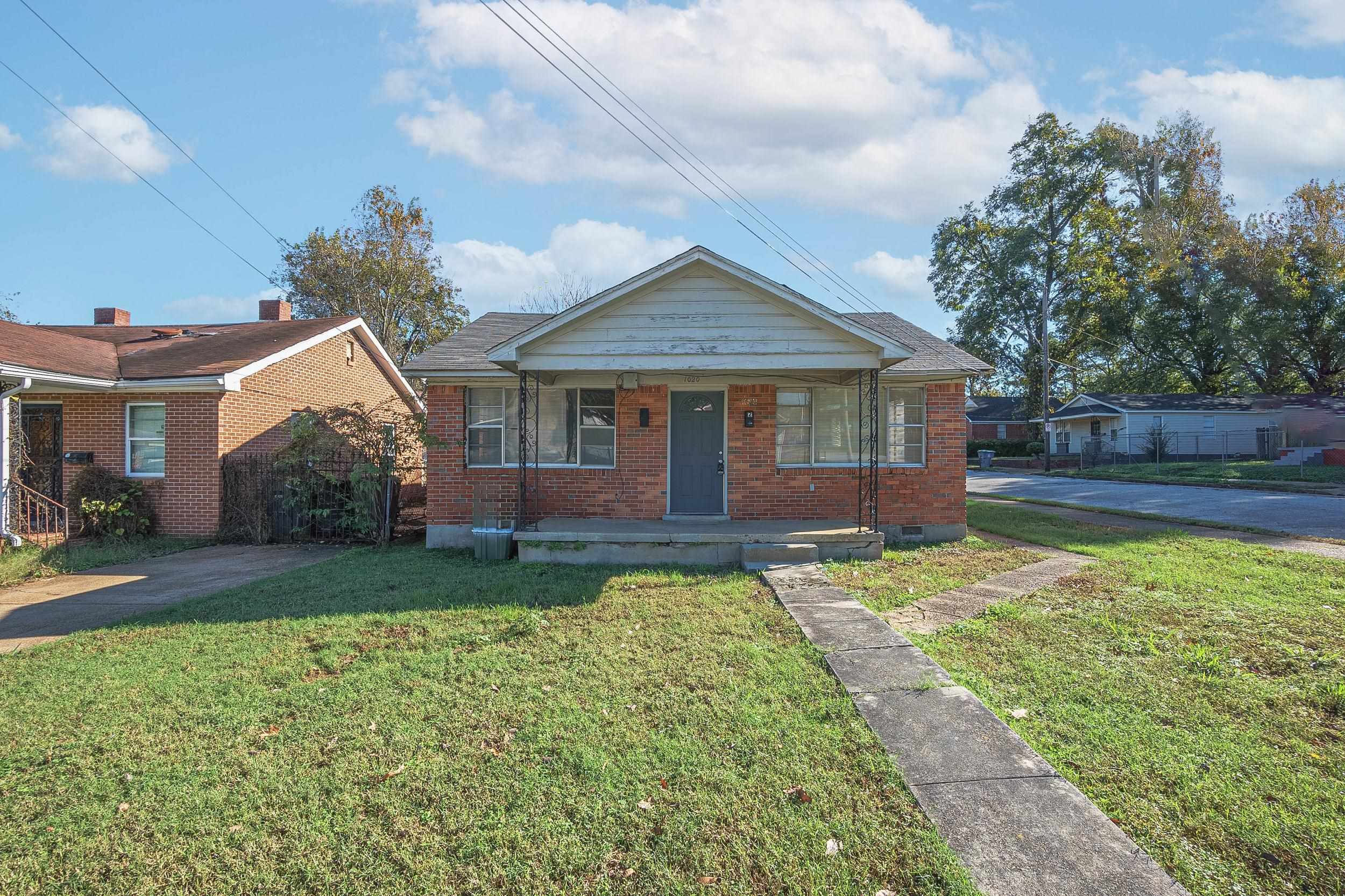 Bungalow-style house featuring a porch and a front lawn