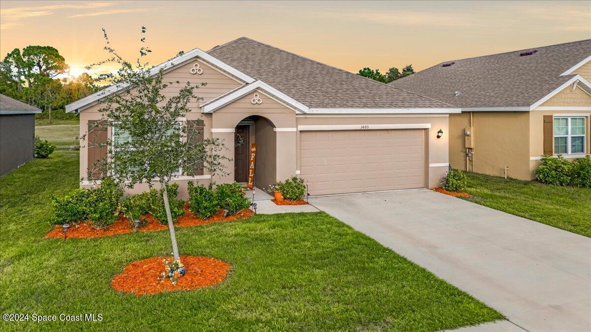 a front view of a house with a yard