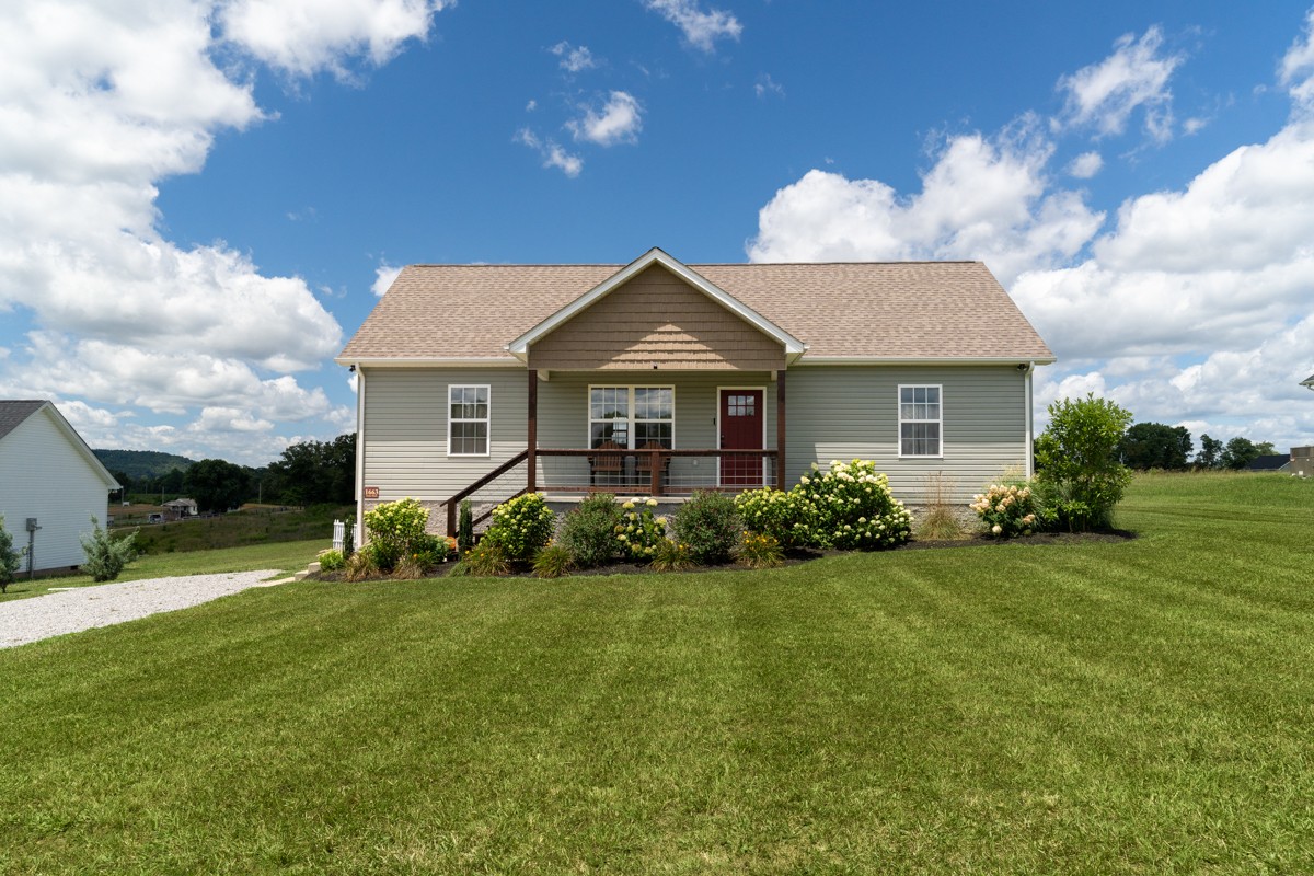 a front view of a house with a yard