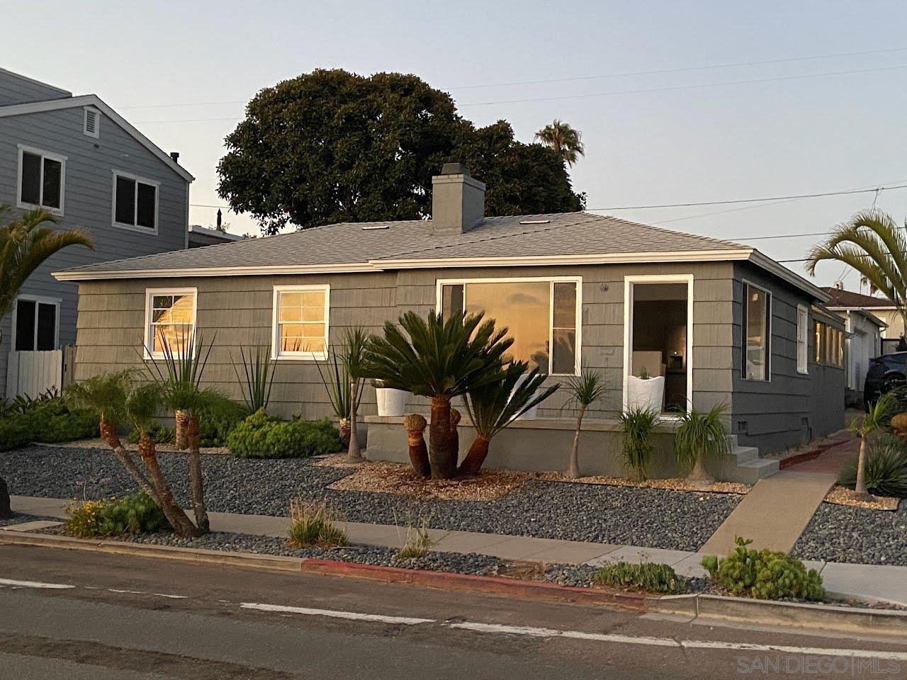 a view of a house with a yard and plants