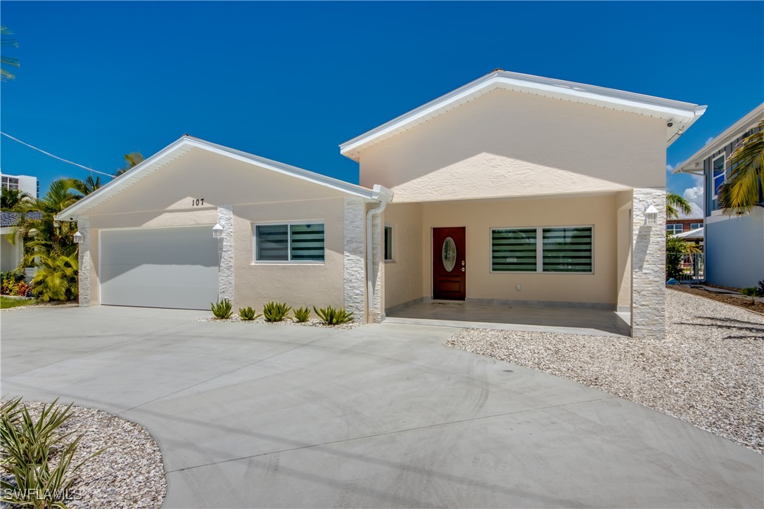 a front view of a house with a garage