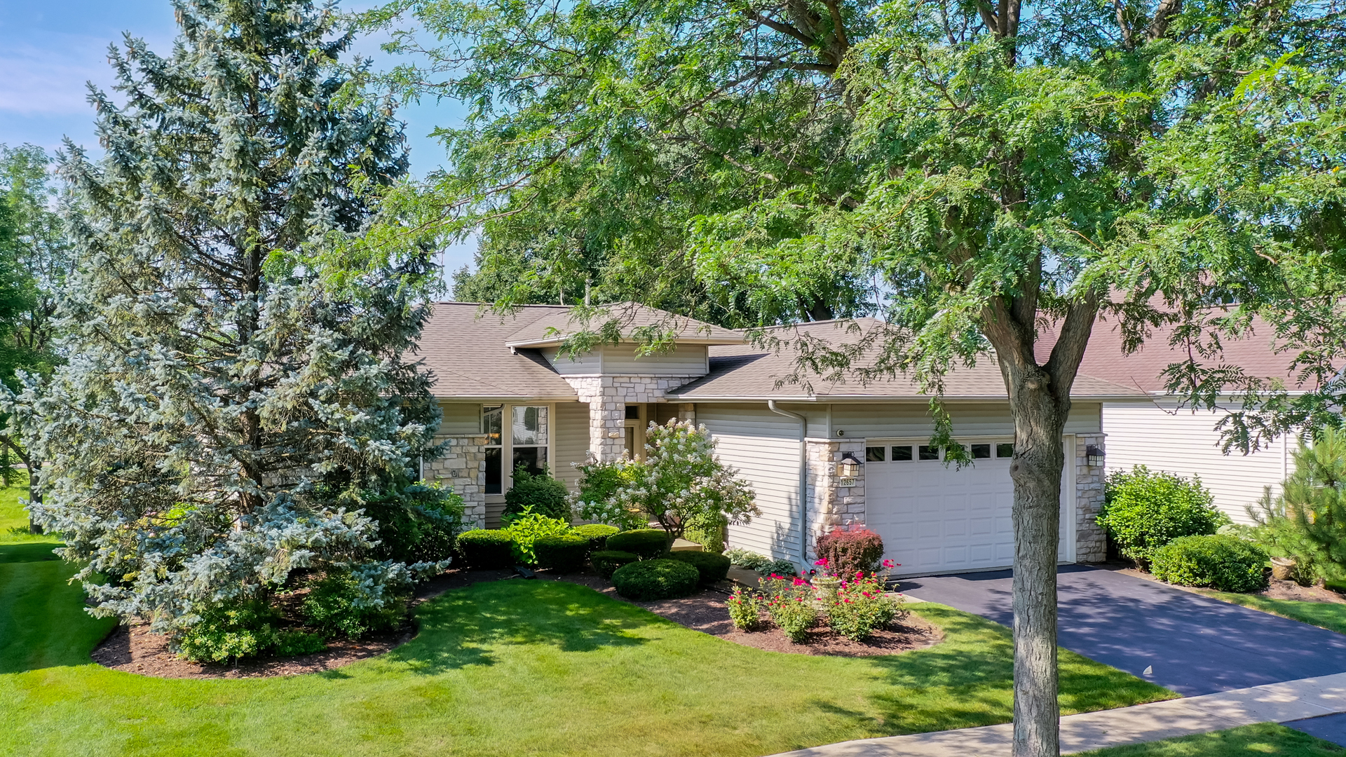 a front view of a house with garden