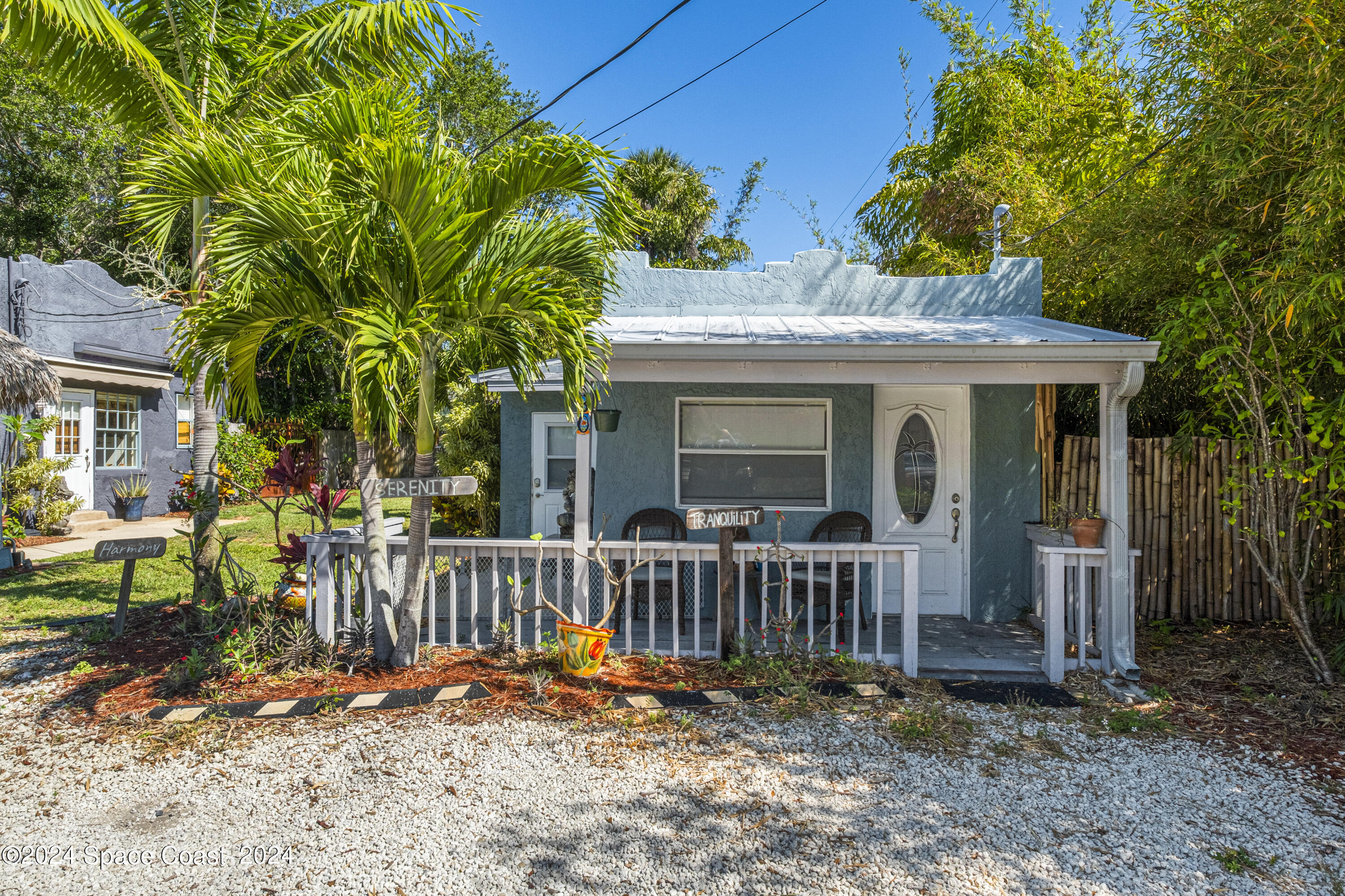 a view of a house with backyard porch and furniture