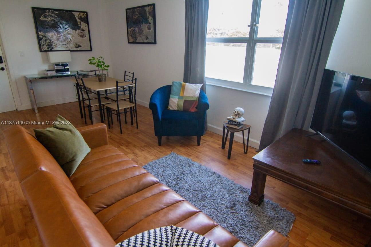 a living room with furniture and a window