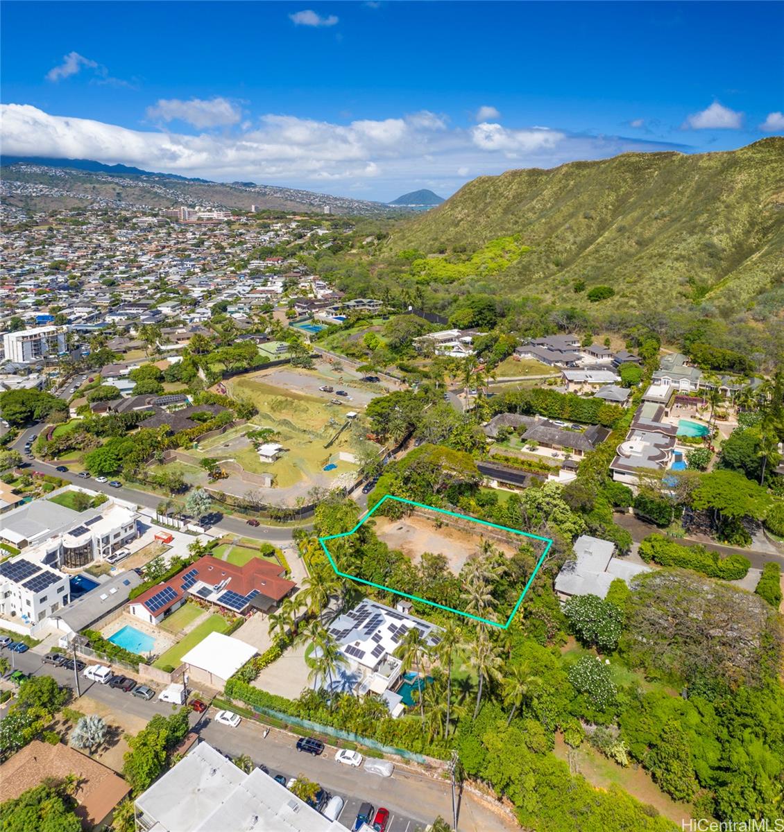 a view of city and green space