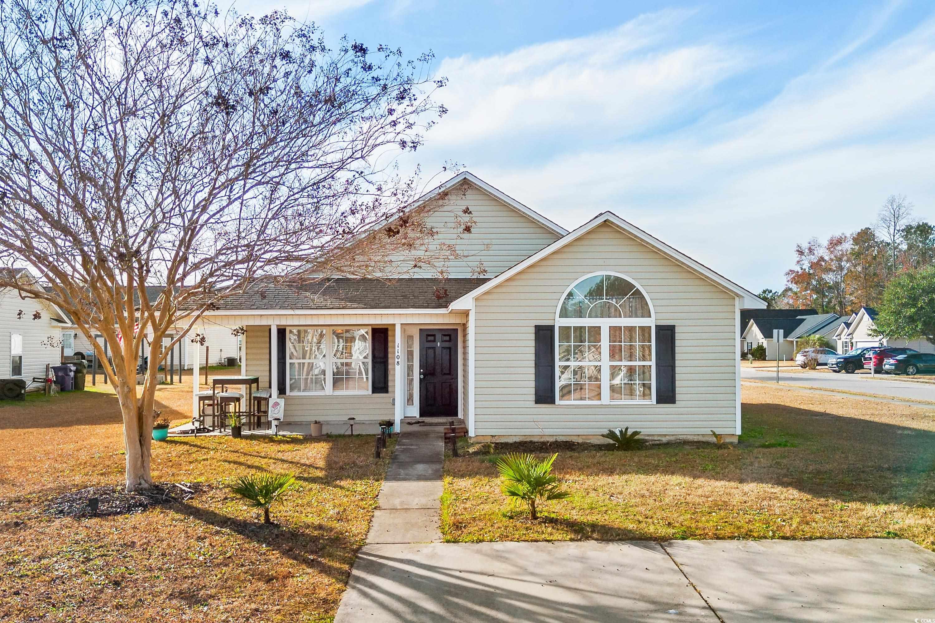 View of front of house with a front yard