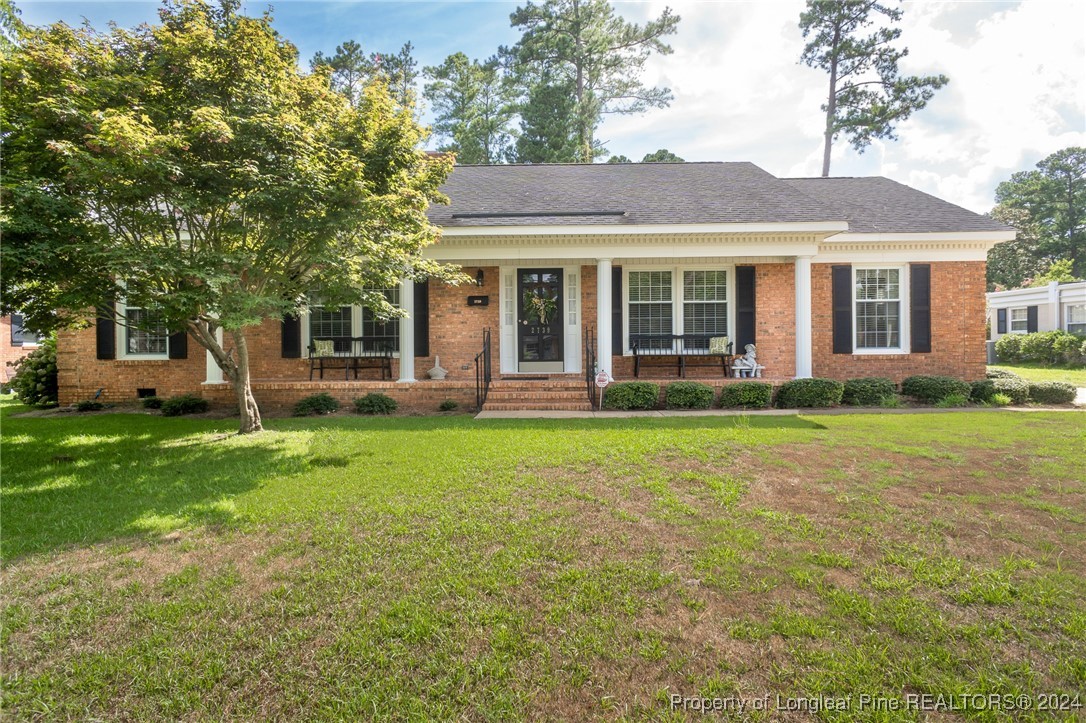 front view of a house with a yard