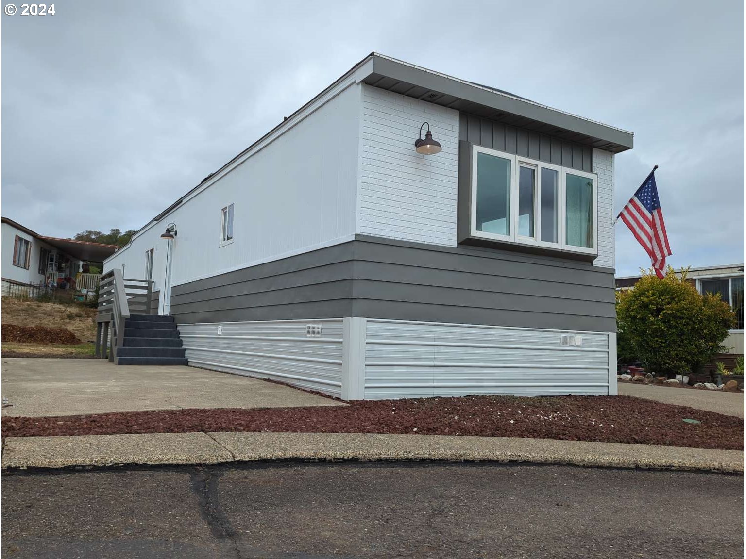 a front view of a house with a garage