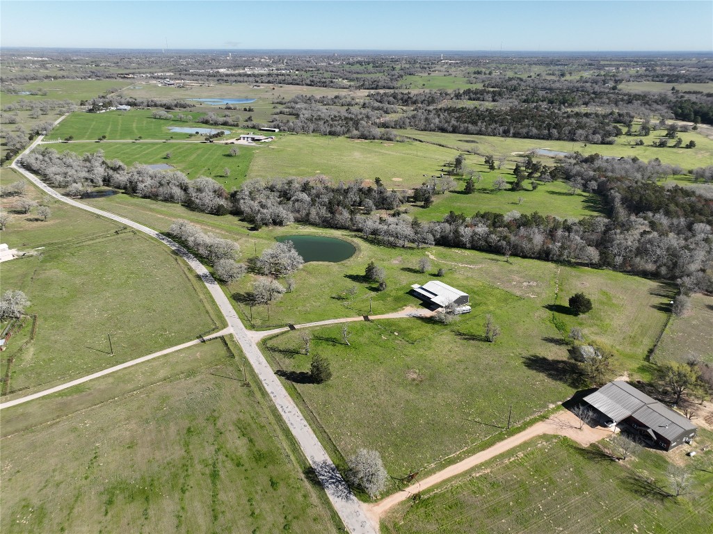 an aerial view of a residential houses with outdoor space