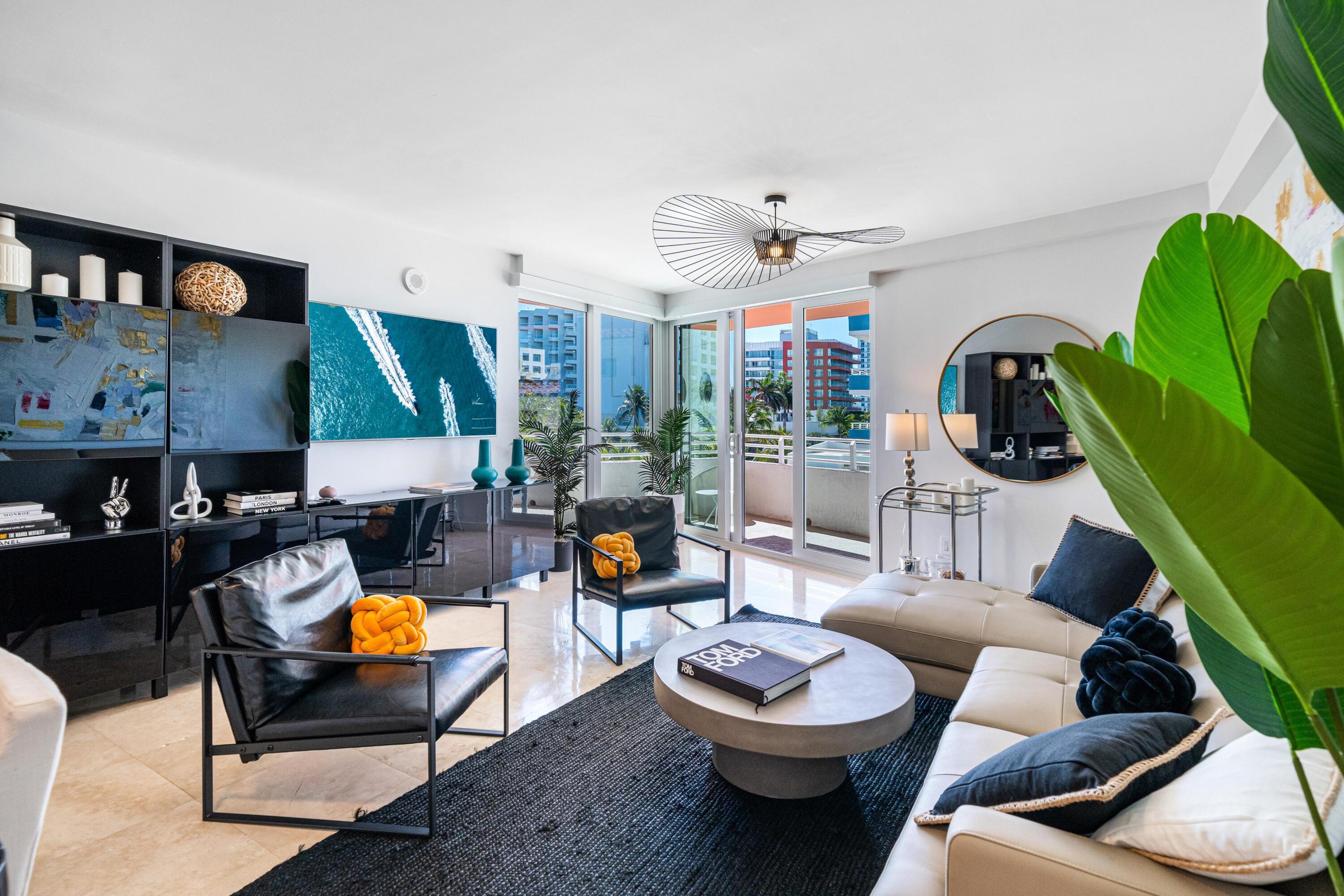 a living room with furniture and a flat screen tv