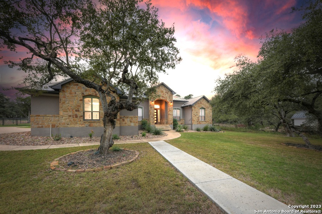 a front view of a house with a yard