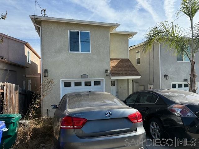 a front view of a house with parking space