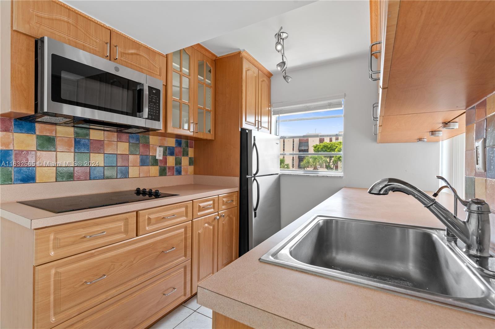 a kitchen with a sink and a microwave