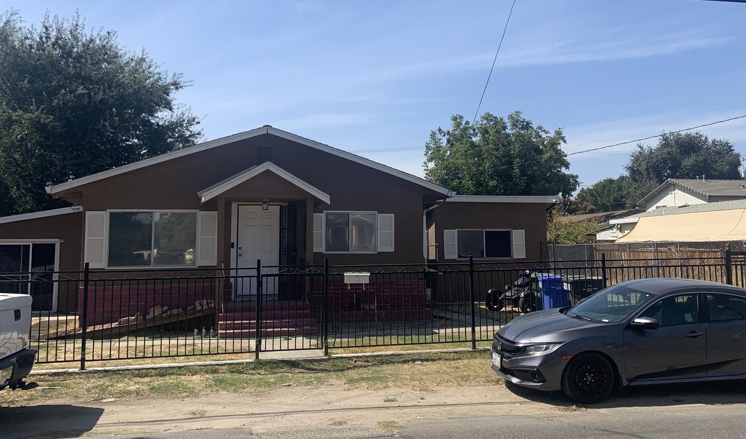 a car parked in front of a house