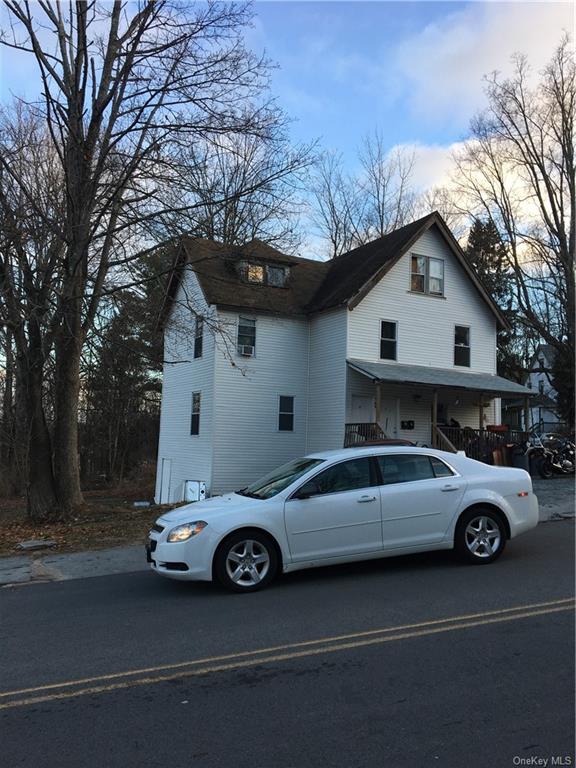 a car parked in front of a house