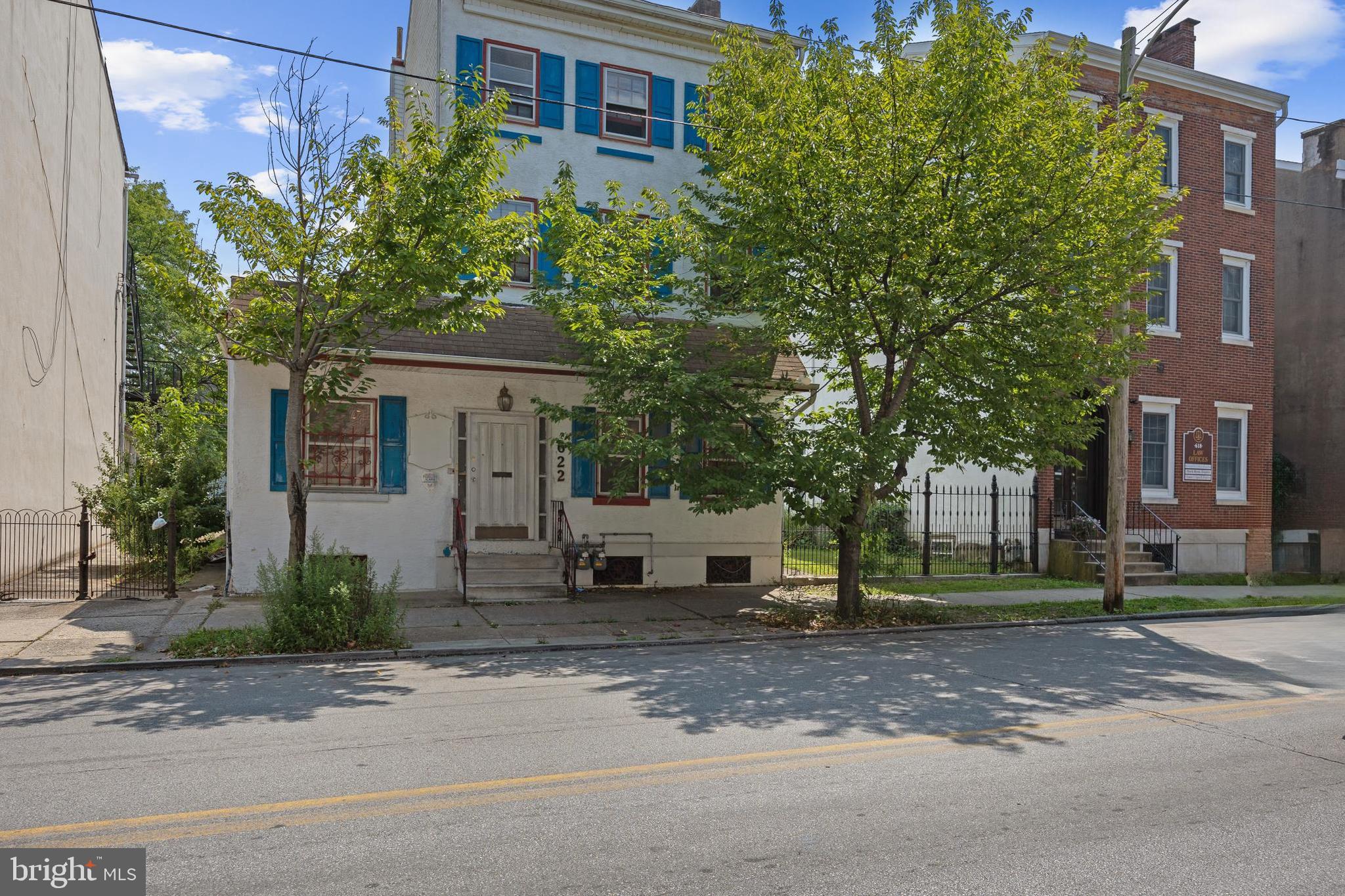 a view of a street in front of a building