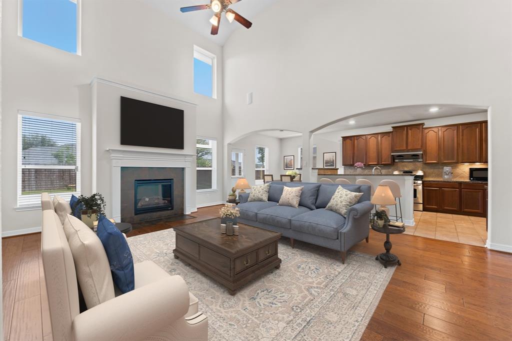 a living room with furniture fireplace and a flat screen tv