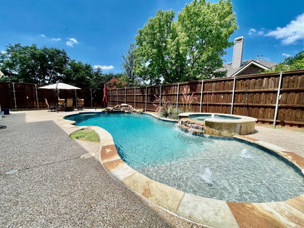 a view of a swimming pool with a lounge chair