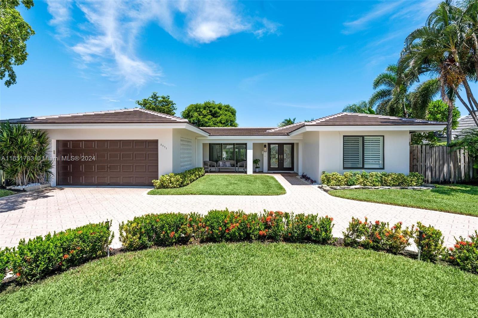 front view of a house with a yard