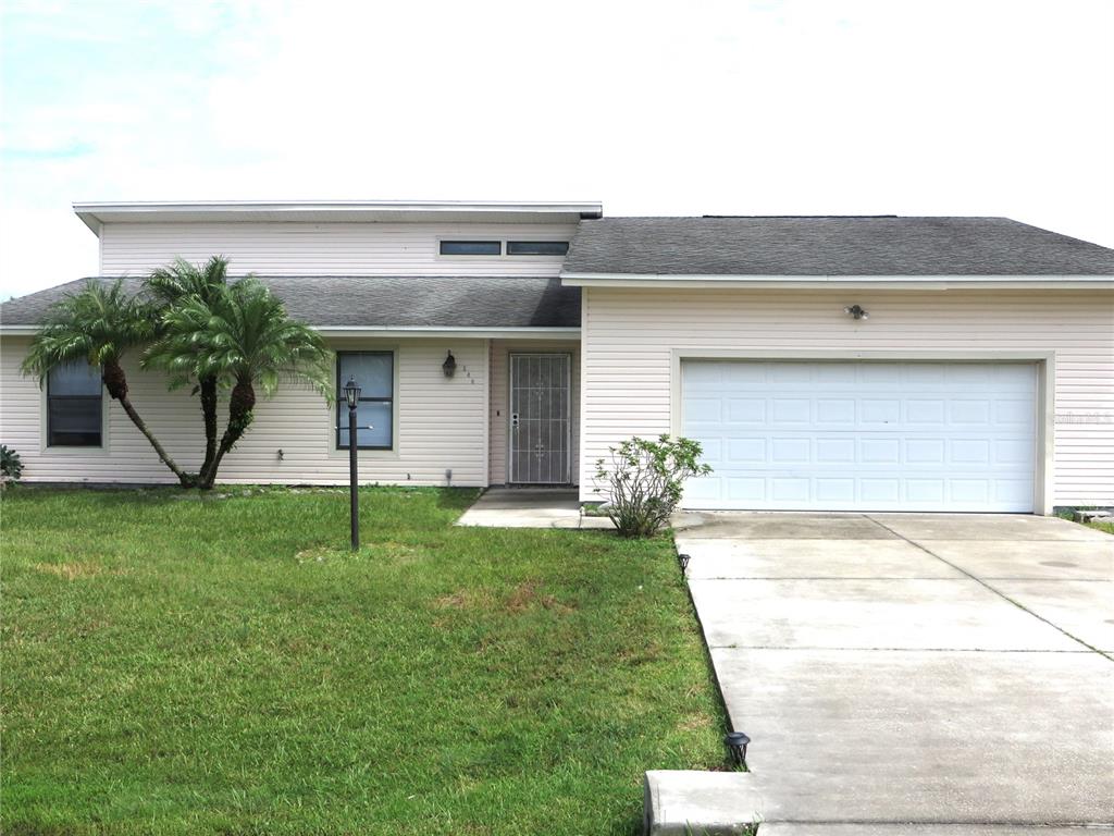 a front view of house with garden