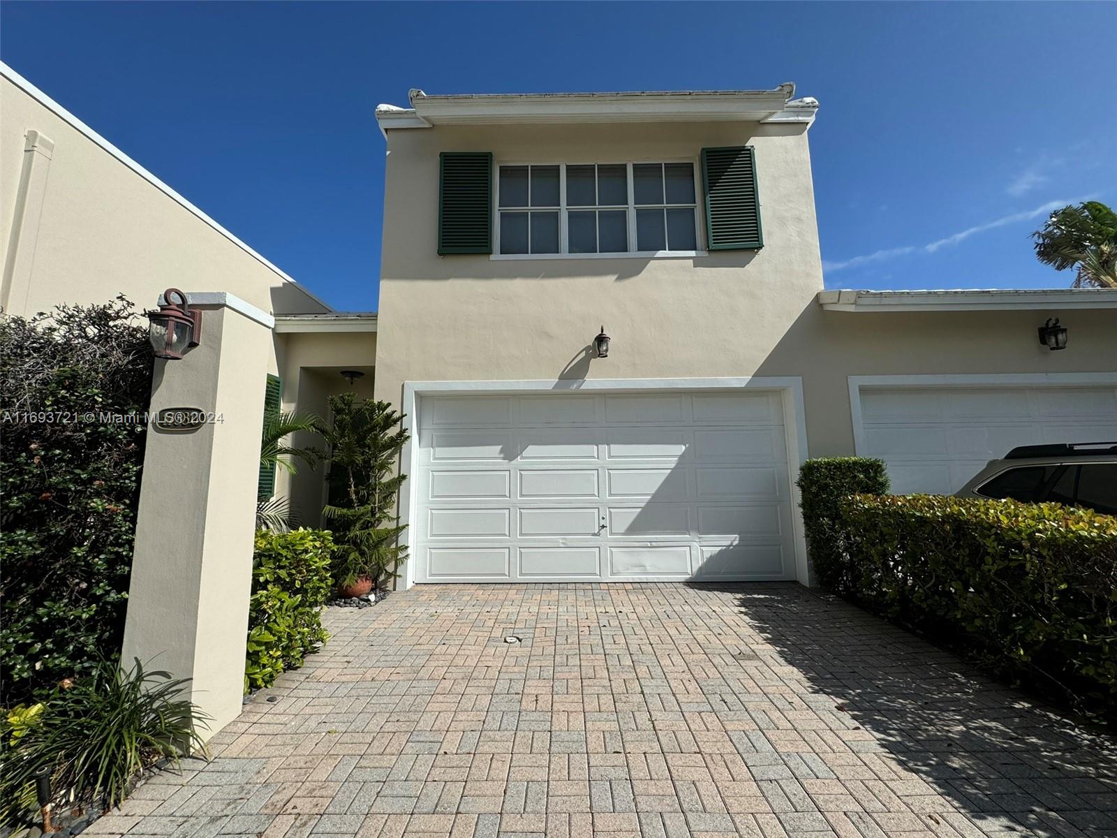 a front view of a house with garage