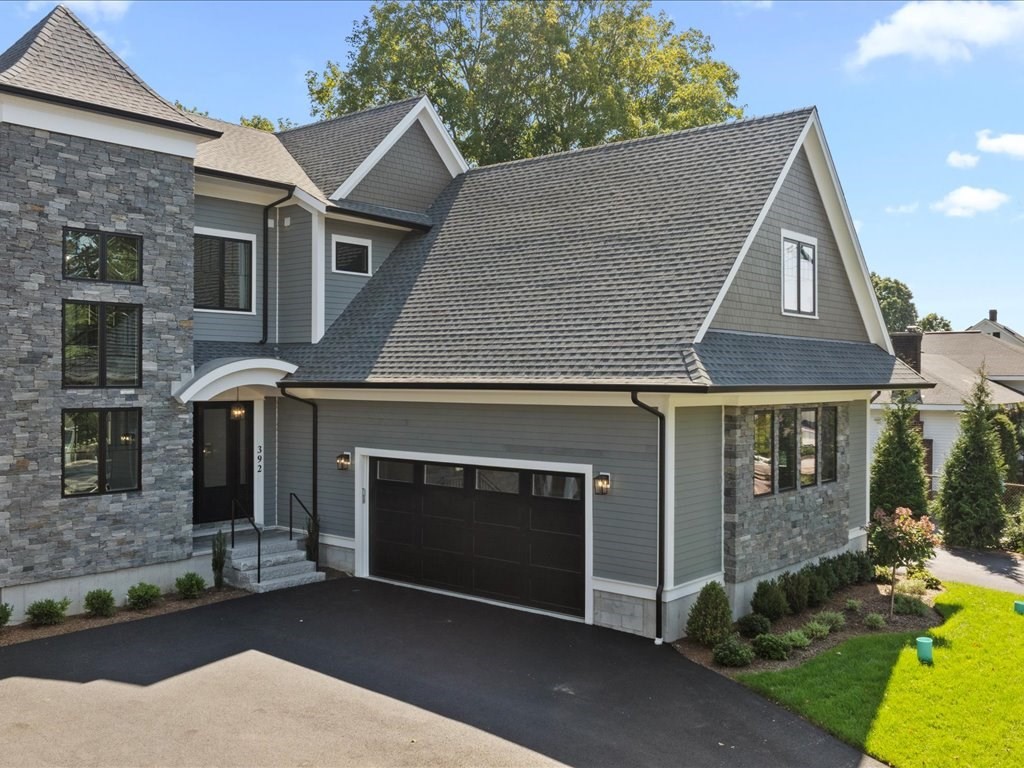 a front view of a house with yard