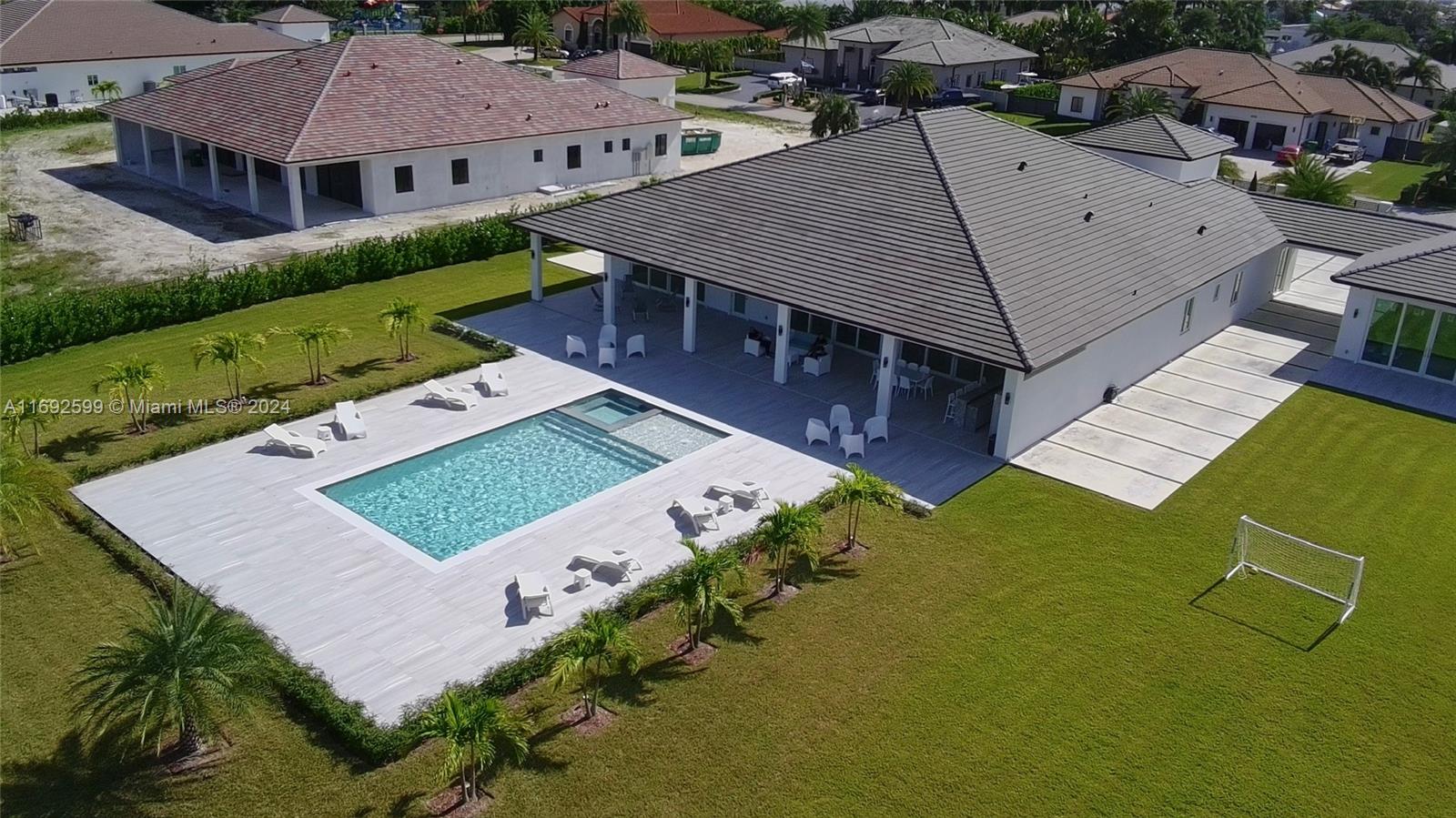 an aerial view of a house with a garden