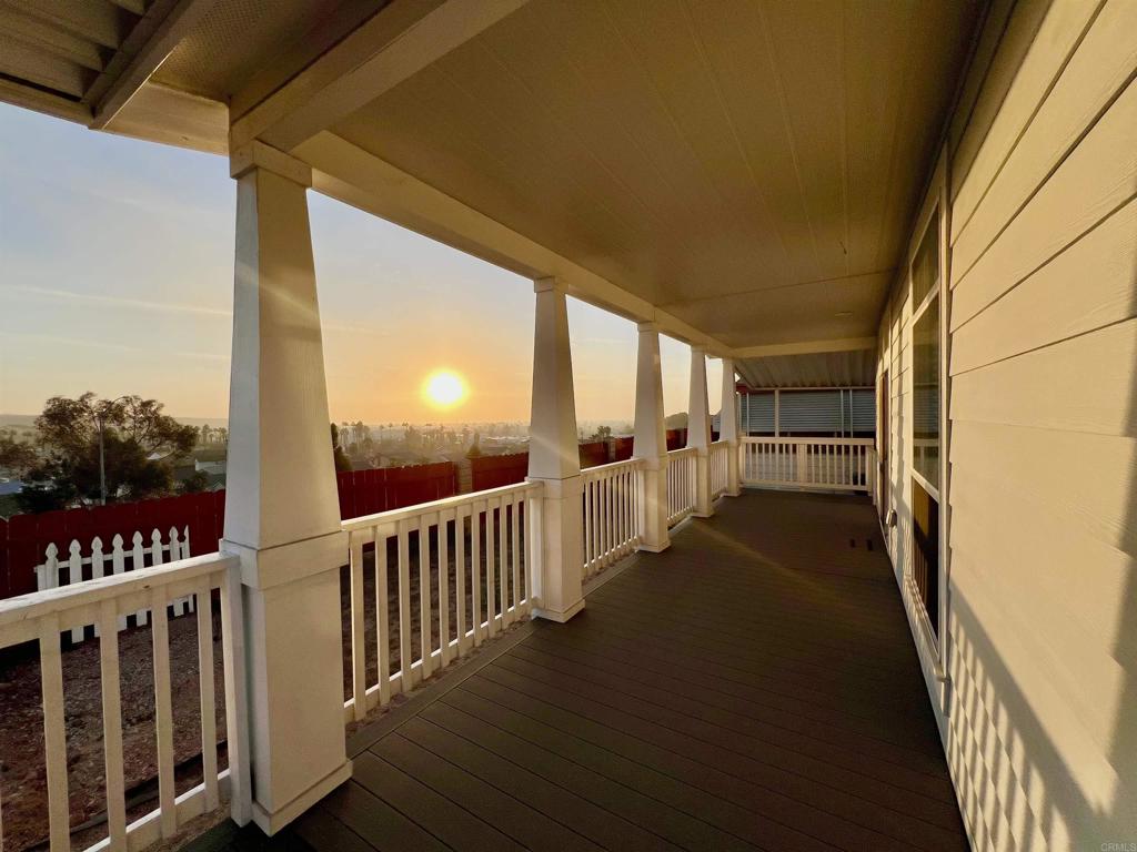 a view of a porch with wooden floor