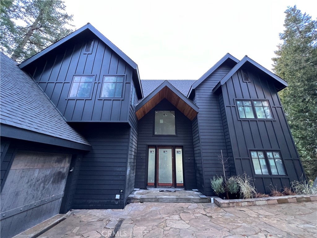 a front view of a house with yard