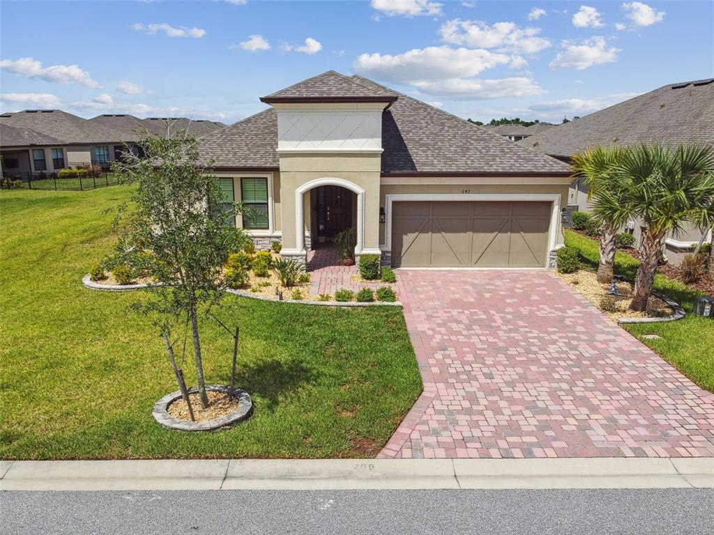 a front view of a house with garden