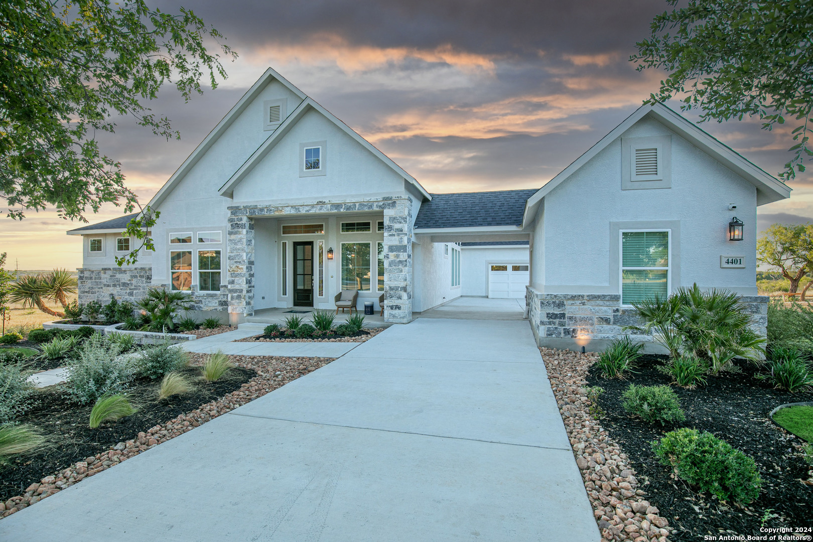 a front view of house with yard and green space