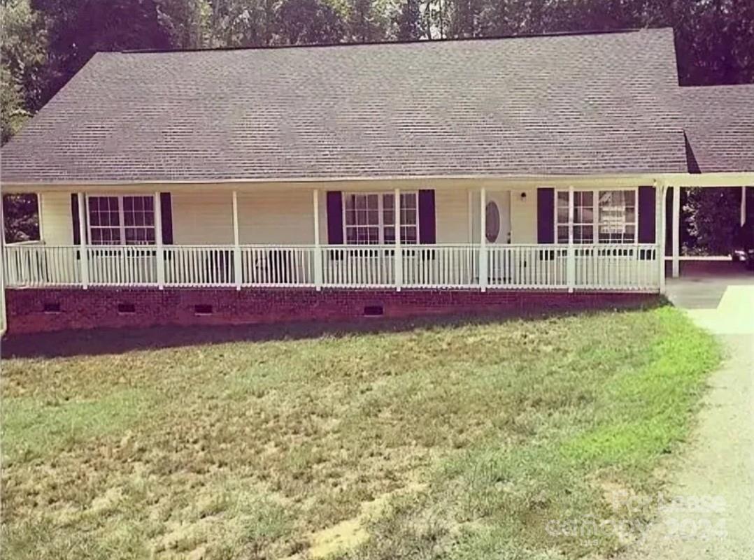 front view of a house with a big yard