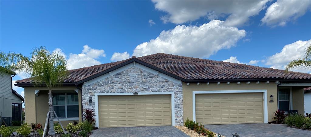 a front view of a house with a garage