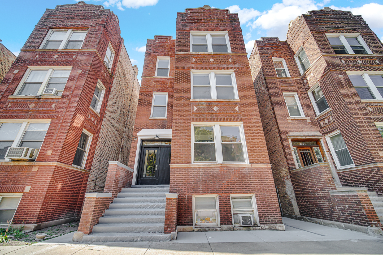 a front view of a multi story residential apartment building