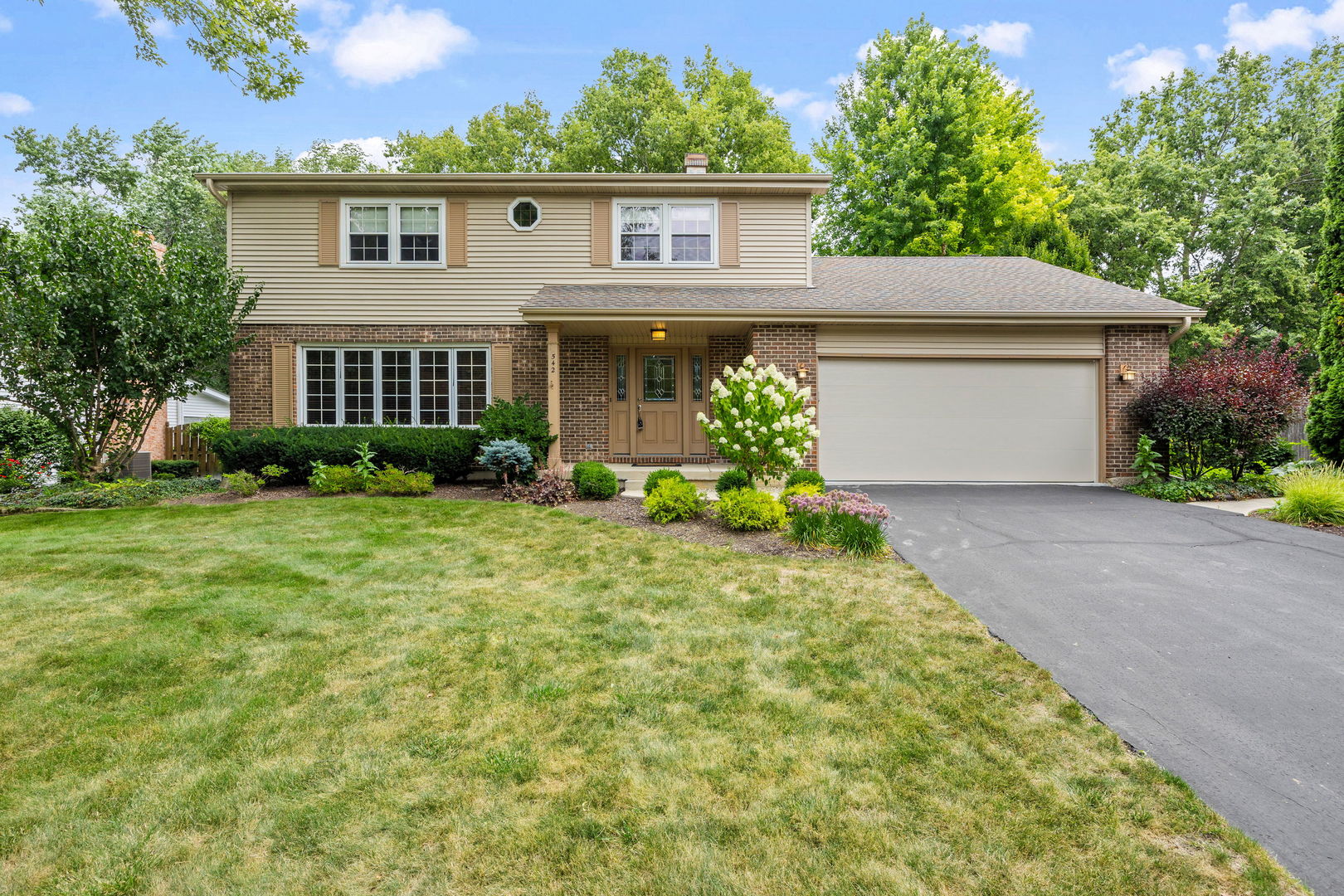 front view of a house with a yard