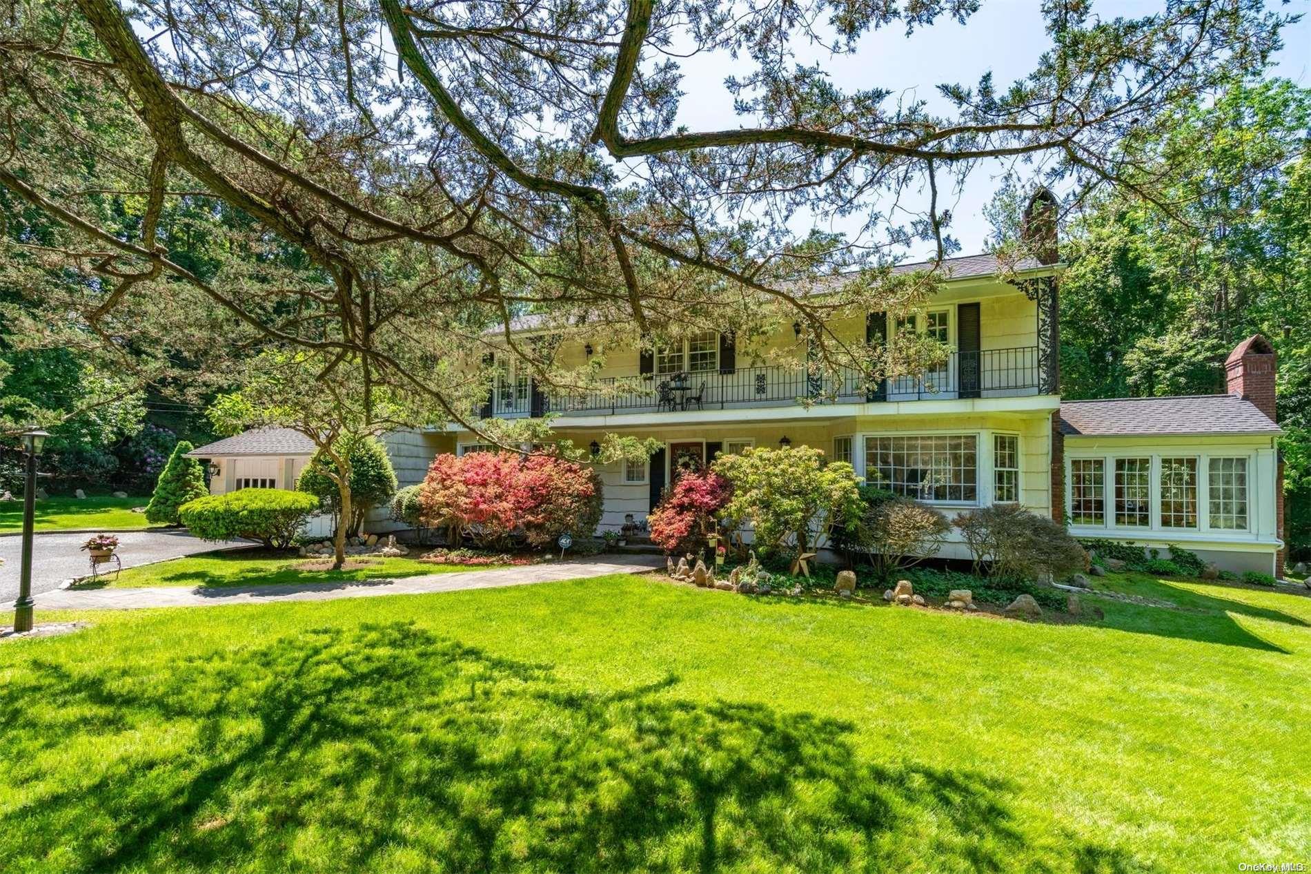 a view of an house with backyard and sitting area