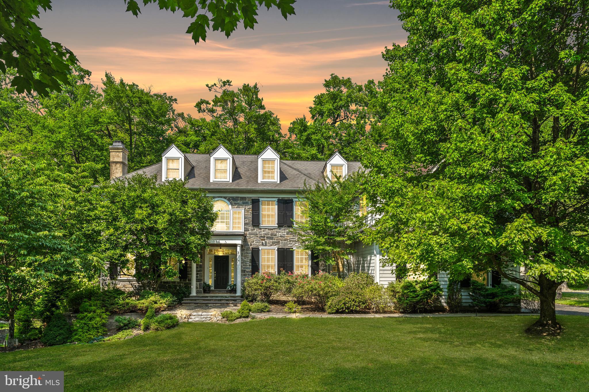 front view of a house with a garden