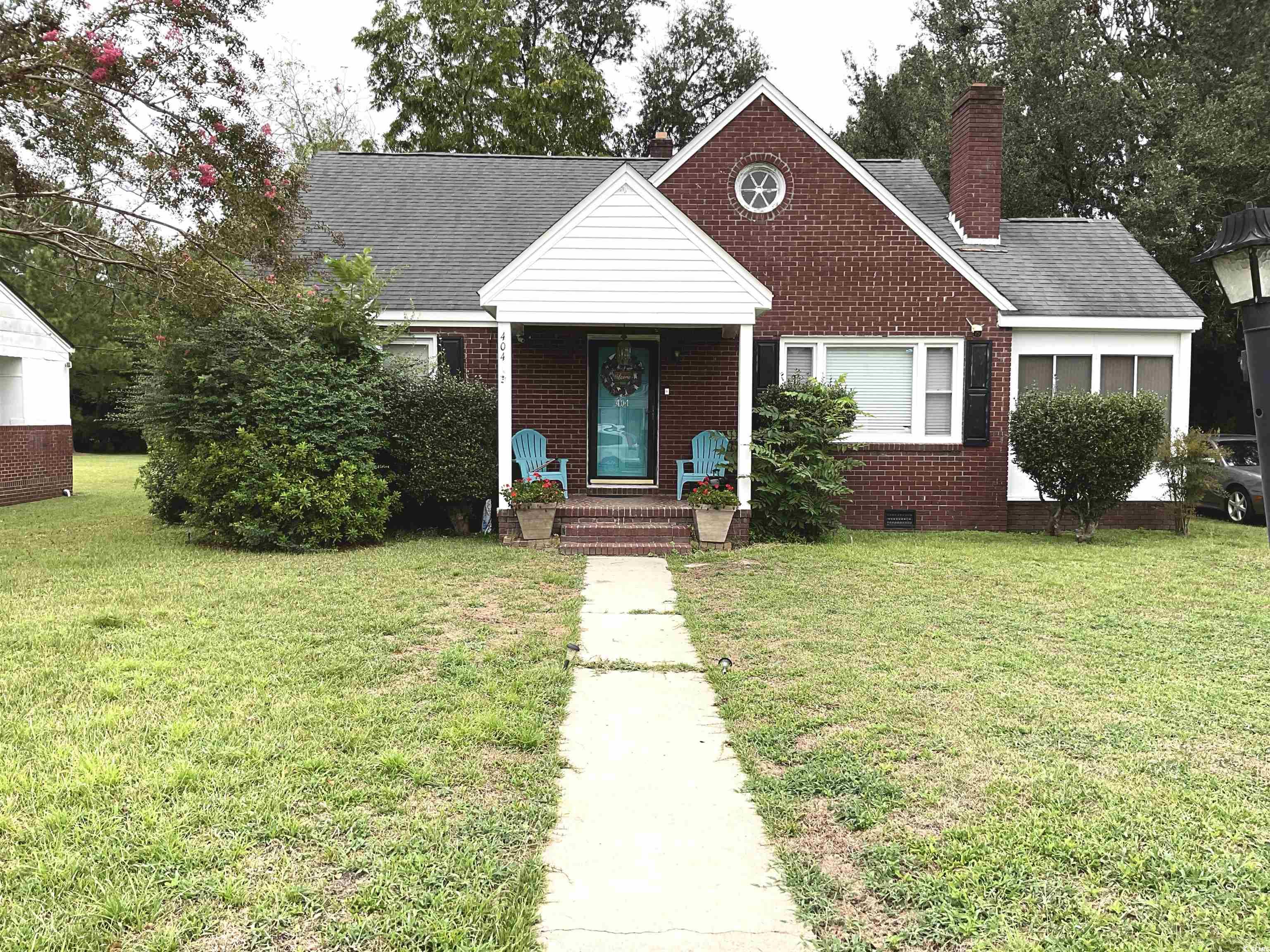 Bungalow-style house with a front yard