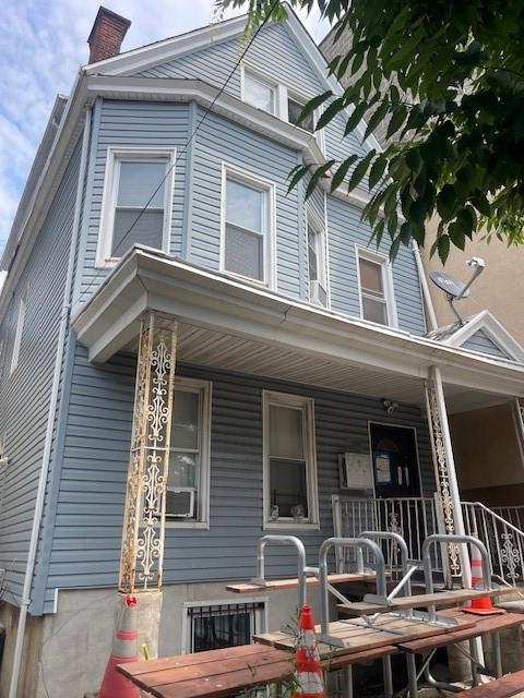 View of front of home featuring covered porch