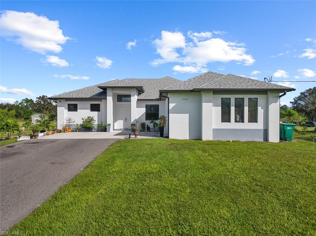 front view of a house with a yard