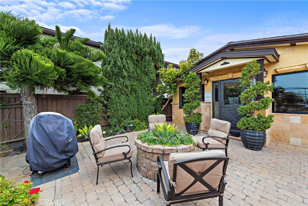 a backyard of a house with outdoor seating