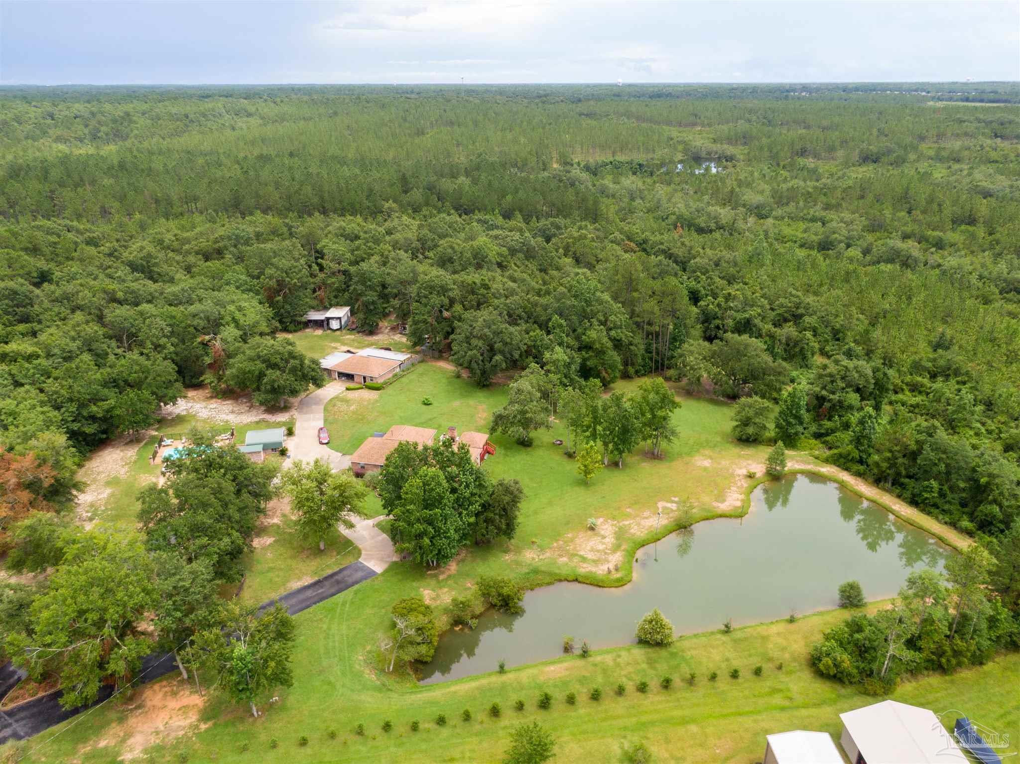 a view of a lake with a yard